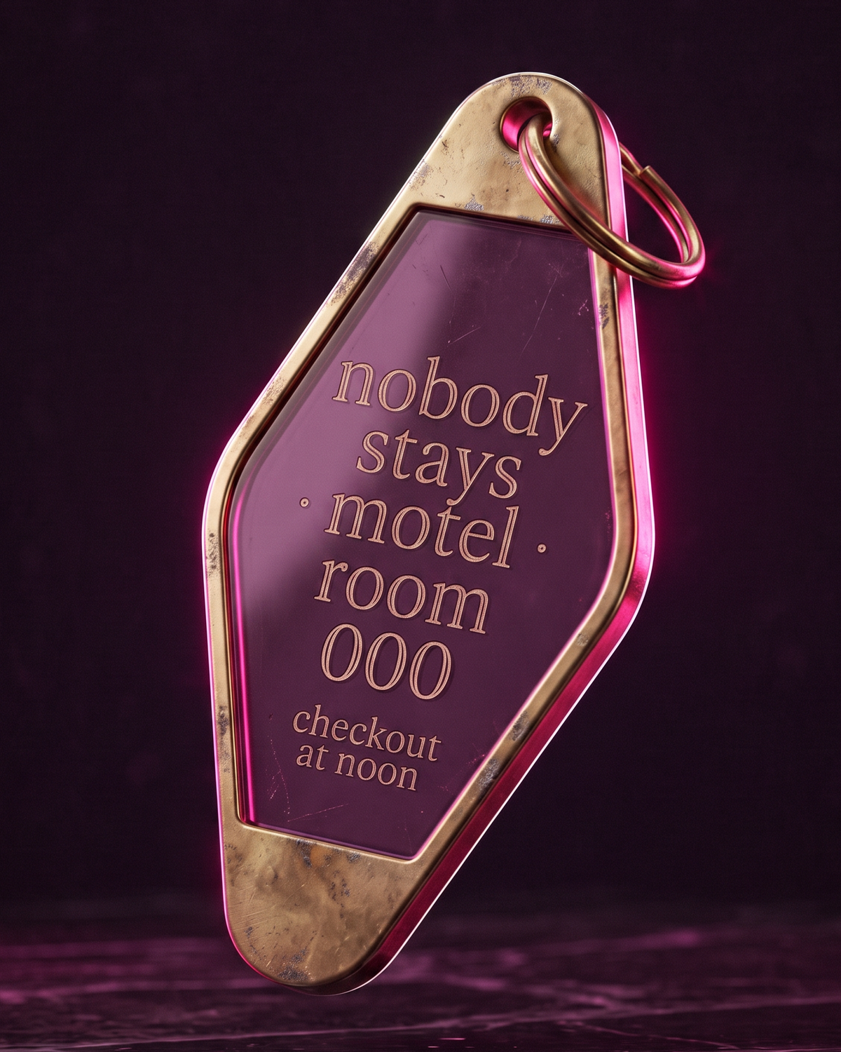 a slightly worn brass and acrylic motel keytag engraved for room 000