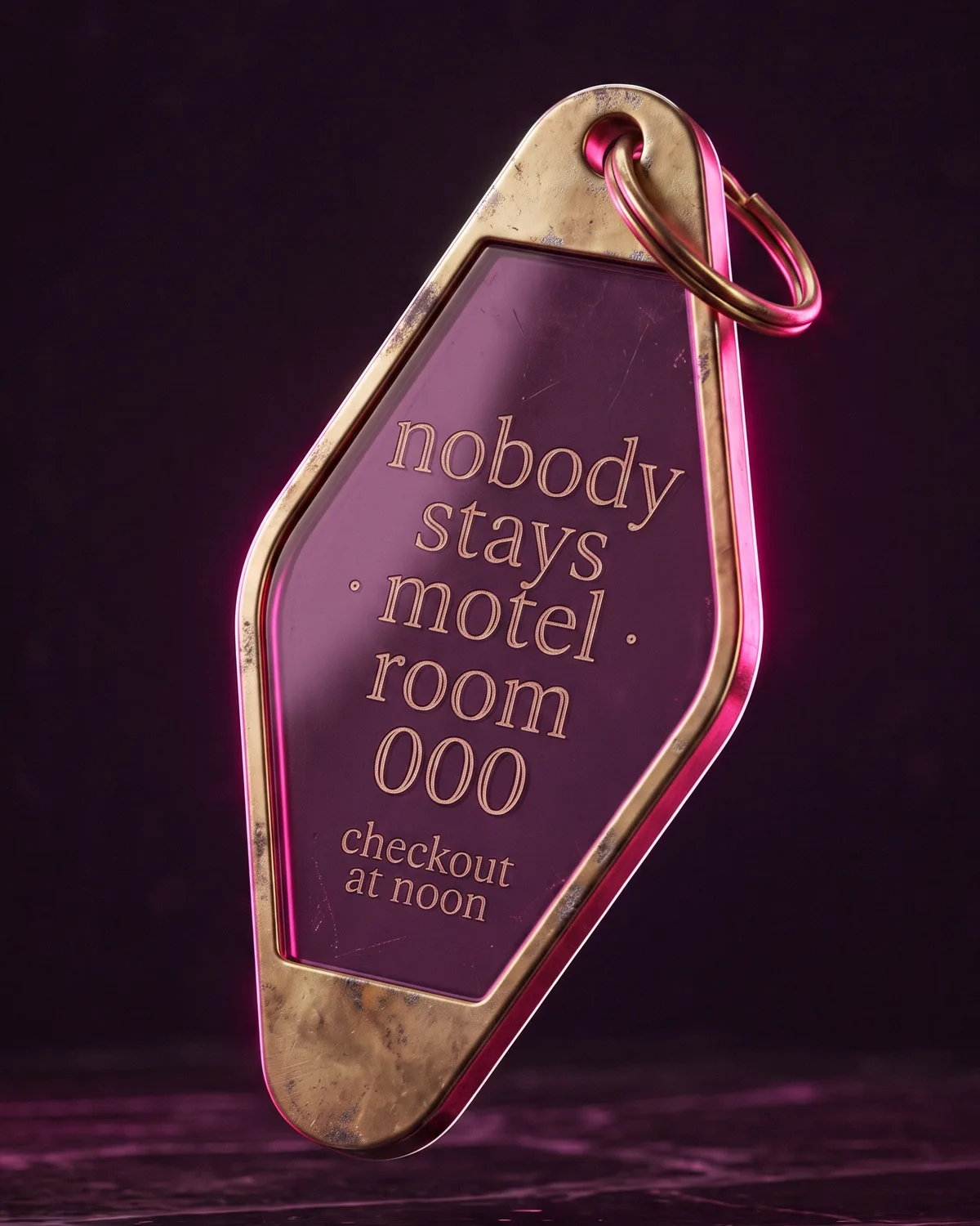 a slightly worn brass and acrylic motel keytag engraved for room 000