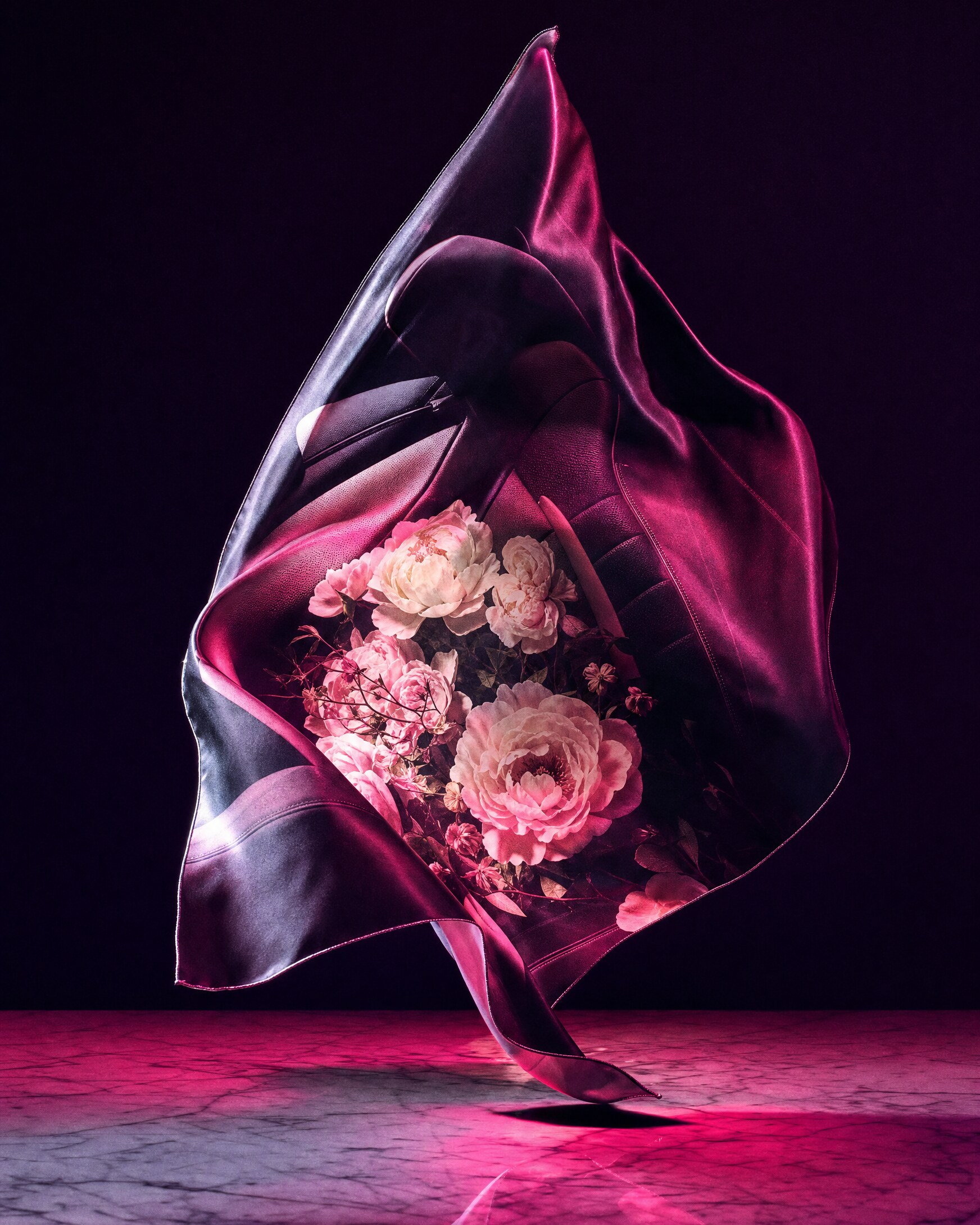 flower-print silk scarf falling above midnight marble